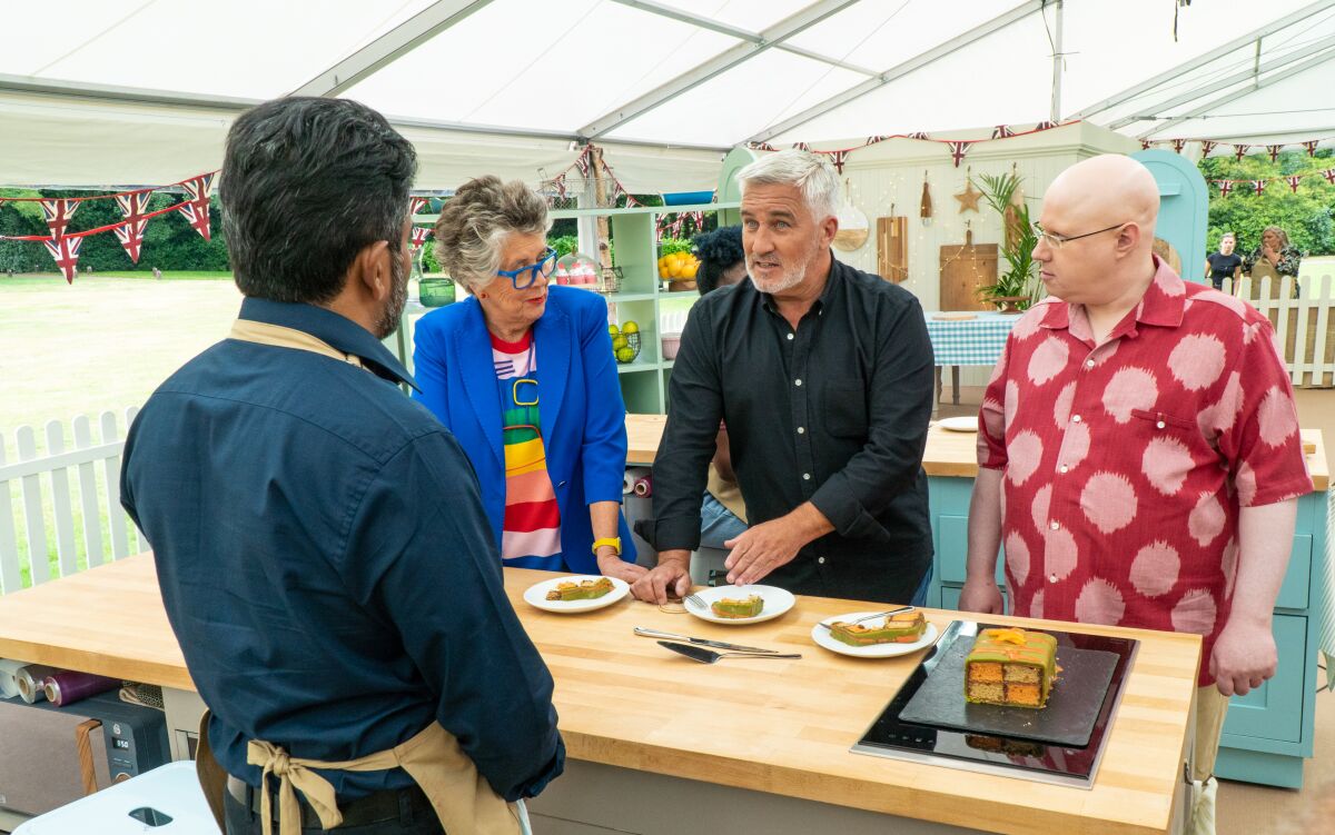Prue Leith Paul Hollywood and Matt Lucas talk to a contestant on "The Great British Baking Show."
