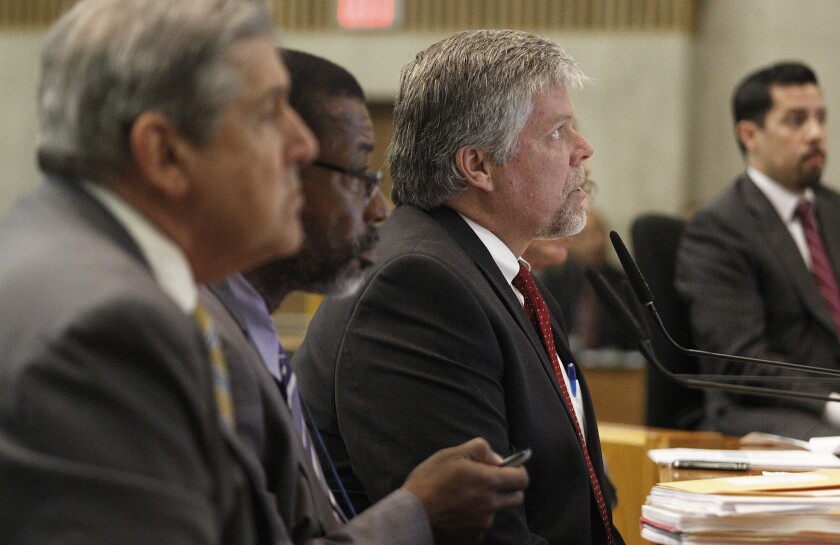 Jerry Powers, center, chief probation officer for Los Angeles County, addresses the Los Angeles County Board of Supervisors in 2013. The probation department recently emerged from six years of federal monitoring of its juvenile camps.