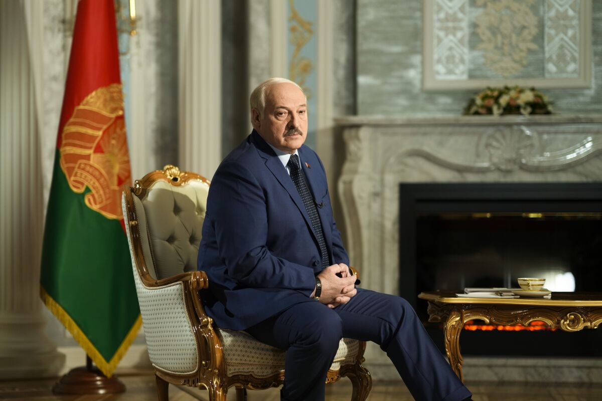 Belarus President Alexander Lukashenko listens to questions during an interview with The Associated Press at the Independence Palace in Minsk, Belarus, Thursday, May 5, 2022. (AP Photo/Markus Schreiber)