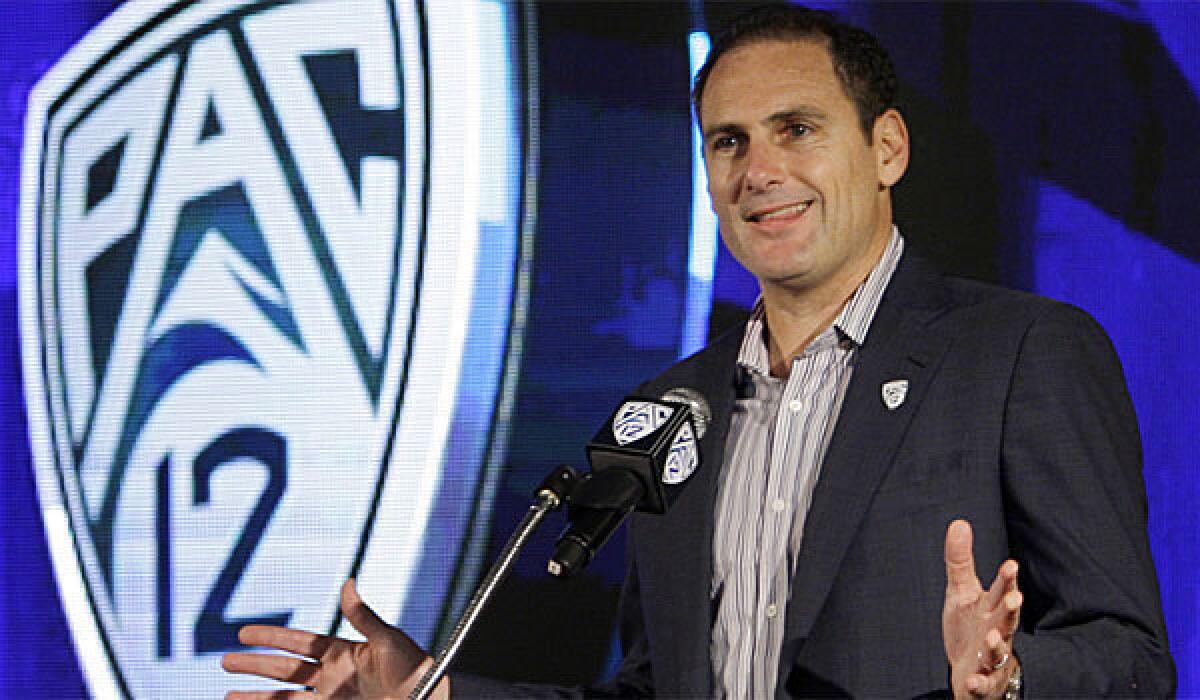 Pac-12 Commissioner Larry Scott, shown in 2011, wrote an op-ed piece in USA Today against a ruling that would allow Northwestern football players to form a union.