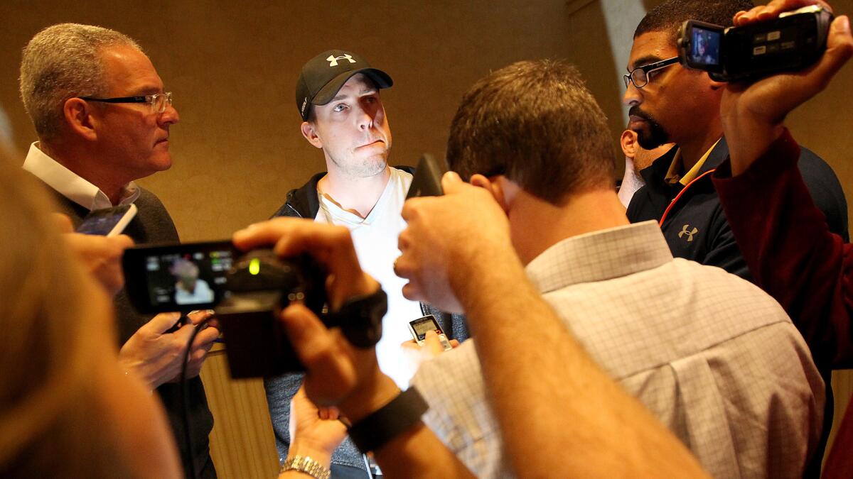Rams quarterback Case Keenum talks with reporters following a team meeting at the Manhattan Beach Marriott on Friday.