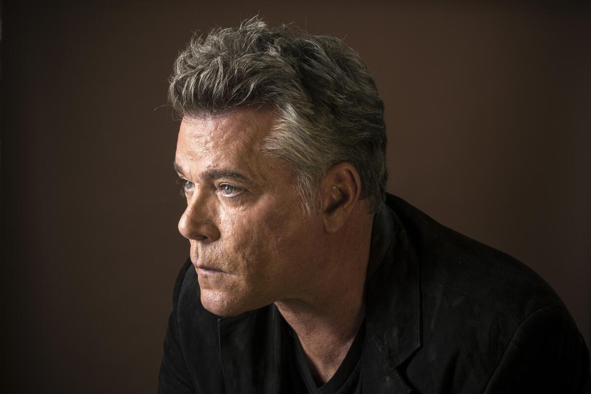 Portrait of Ray Liotta gazing solemnly to the left.
