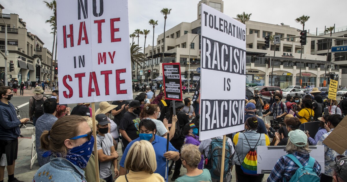 Tensions rise among rival protesters in Huntington Beach