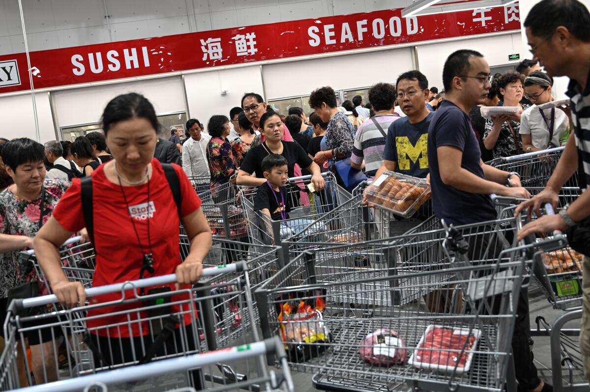 People visit the first Costco outlet in China.