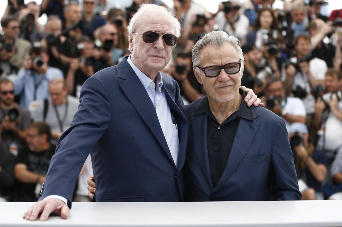 Sir Michael Caine, left and Harvey Keitel pose during the photocall for "Youth" at the 68th Cannes Film Festival.