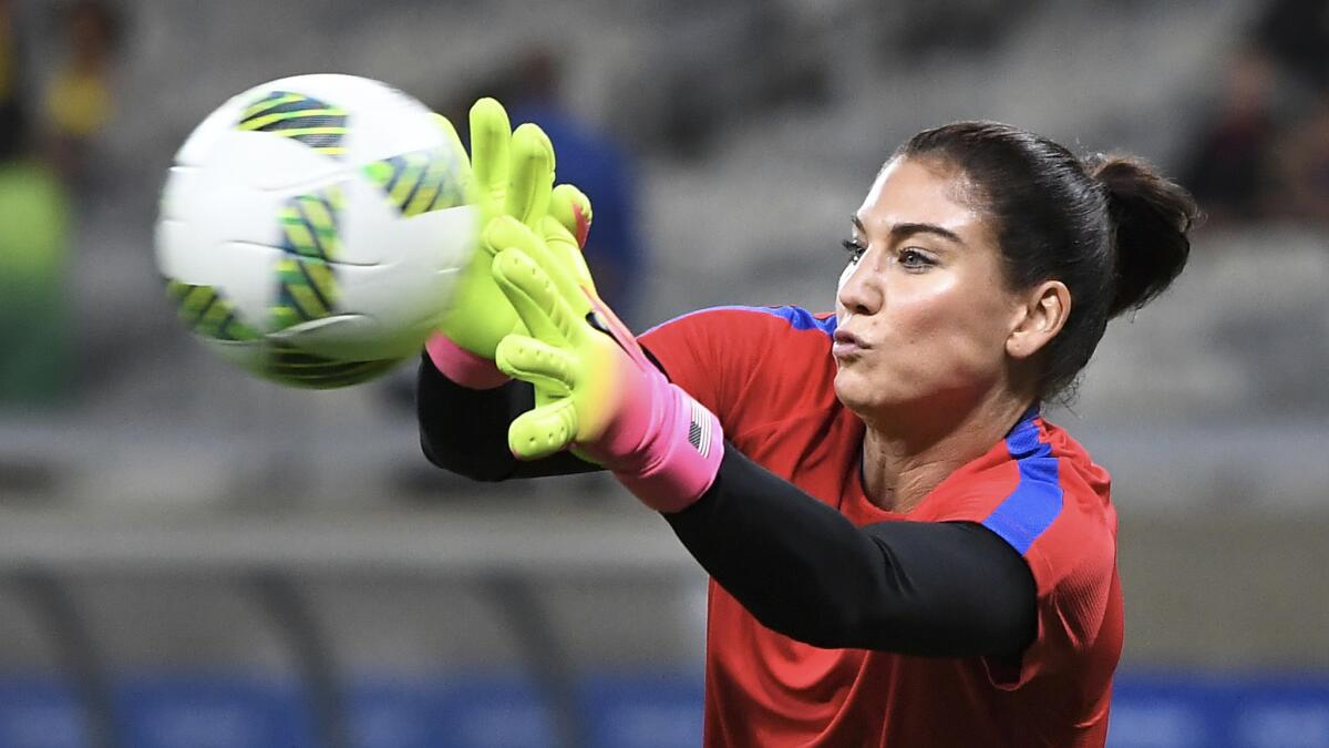 U.S. goalkeeper Hope Solo warms up before a game against New Zealand at the 2016 Rio Olympics in Bella Horizonte, Brazil. After the U.S. lost to Sweden in a quarterfinal match, Solo called the Swedish team a "bunch of cowards" for playing in a defensive shell.