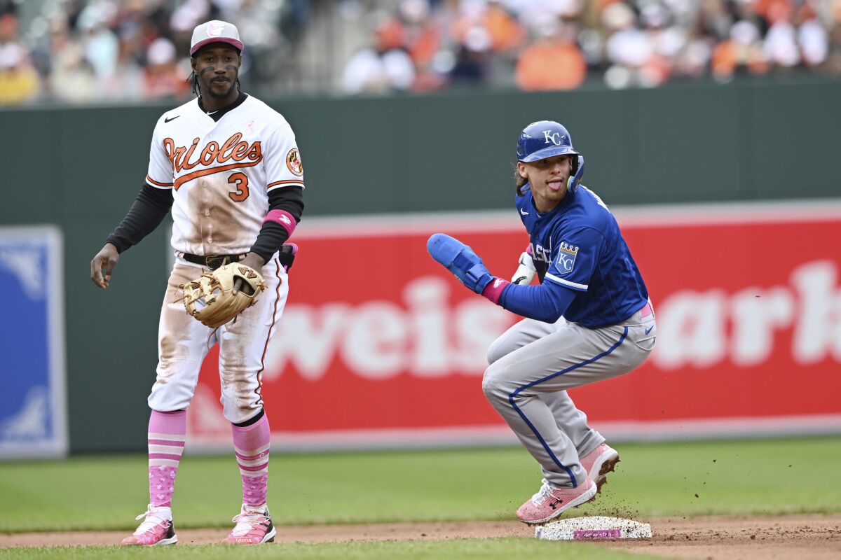 Kansas City Royals' Bobby Witt Jr., right, advances to second base on a single by Kyle Isabel as Baltimore Orioles shortstop Jorge Mateo covers, during the fifth inning of a baseball game, Sunday, May 8, 2022, in Baltimore. (AP Photo/Gail Burton)