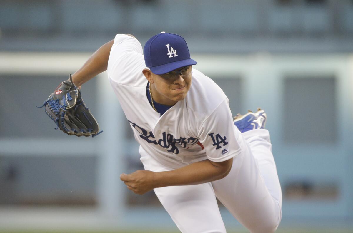 Julio Urias throws against the Milwaukee Brewers during the first inning of a baseball game, Friday, June 17, 2016, in Los Angeles. (AP Photo/Jae C. Hong