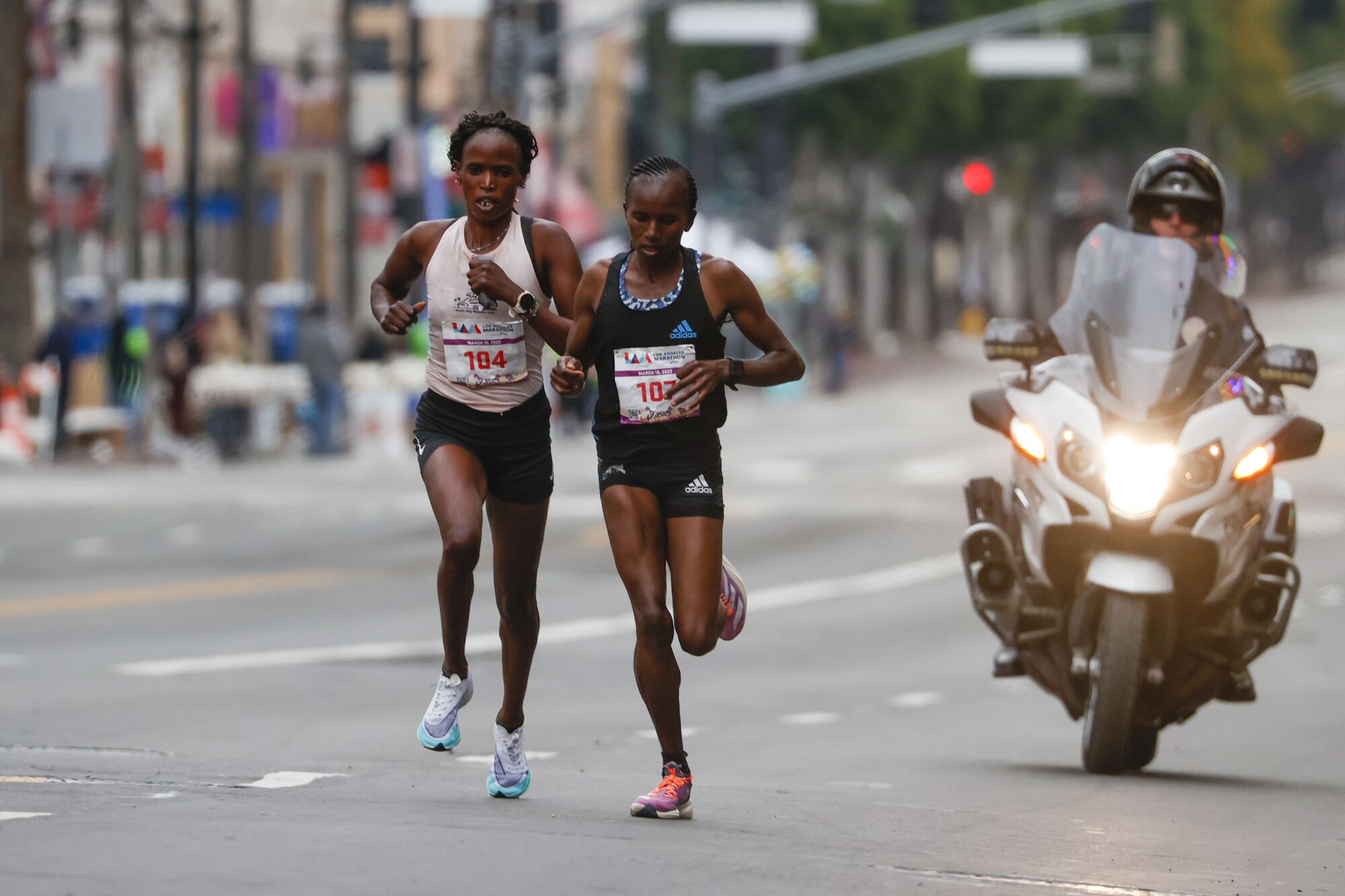 Women's elite runners run along Hollywood Blvd during the 38th LA Marathon in Los Angeles, Sunday