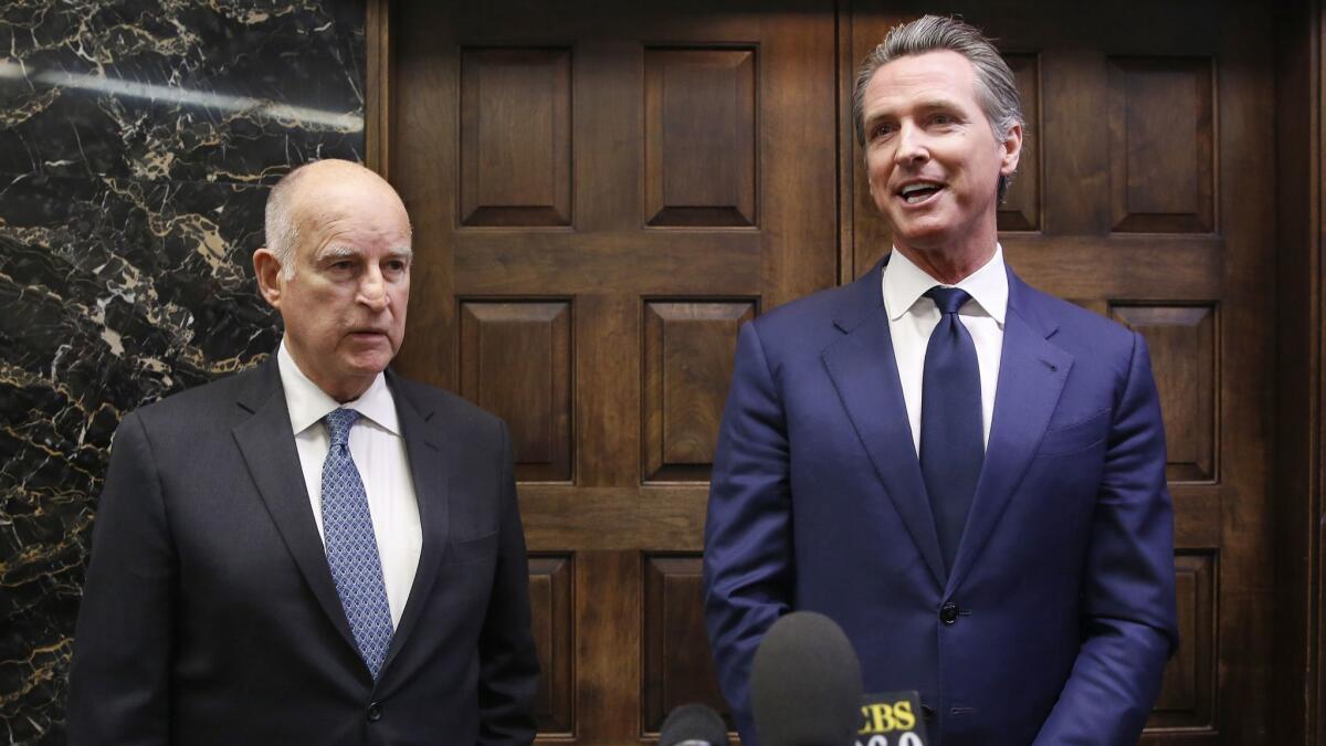 Jerry Brown and Gavin Newsom in November after Newsom was elected governor. Newsom likes to swing for the fences as a politician; the cautious Brown played the percentages.