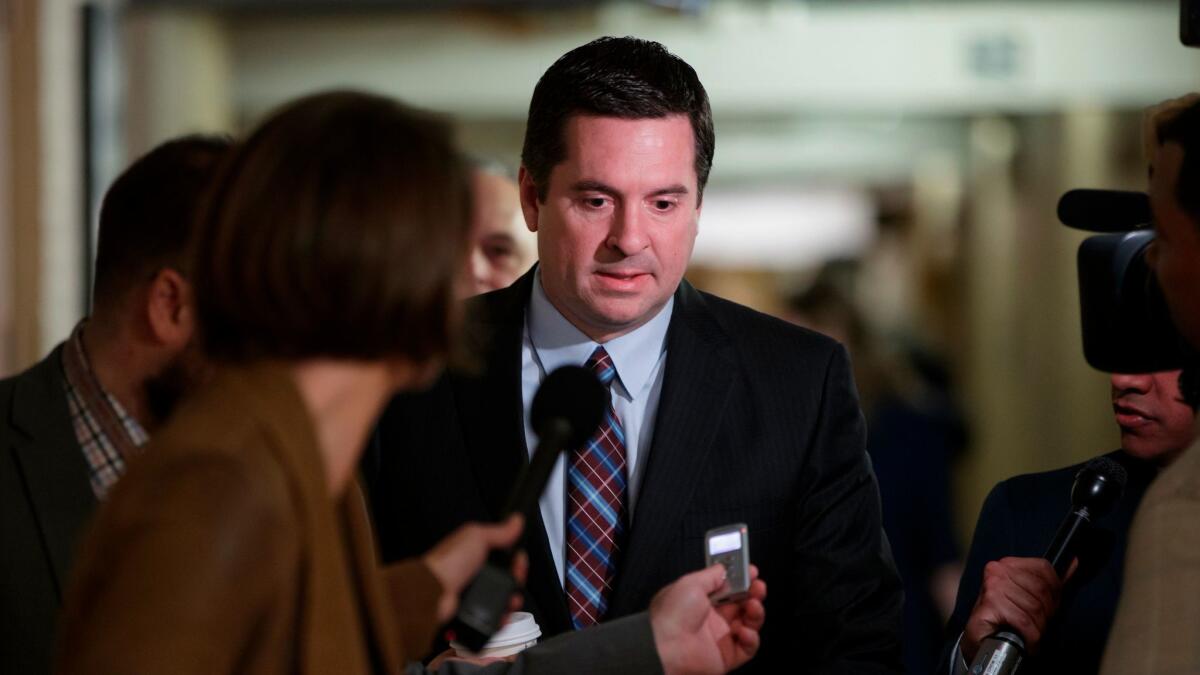 House Intelligence Committee Chairman Devin Nunes (R-Tulare) is pursued by reporters on Capitol Hill.