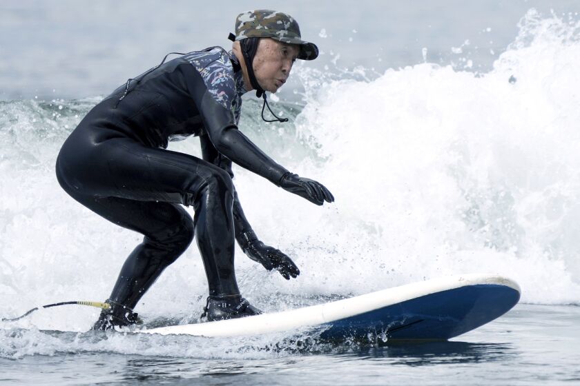 Seiichi Sano, an 89-year-old Japanese man, rides a wave at Katase Nishihama Beach, Thursday, March 30, 2023, in Fujisawa, south of Tokyo. Sano, who turns 90 later this year, has been recognized by the Guinness World Records as the oldest male to surf. (AP Photo/Eugene Hoshiko)