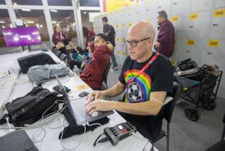  Journalist Grant Wahl (right) works in the FIFA Media Center before a FIFA World Cup Qatar 2022 
