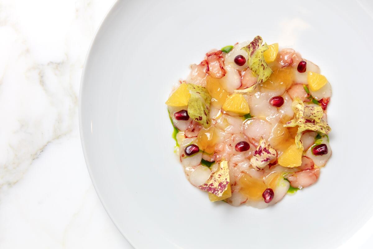 Wild Prawn carpaccio with radicchio, pomegranate, citrus and chilled consomme