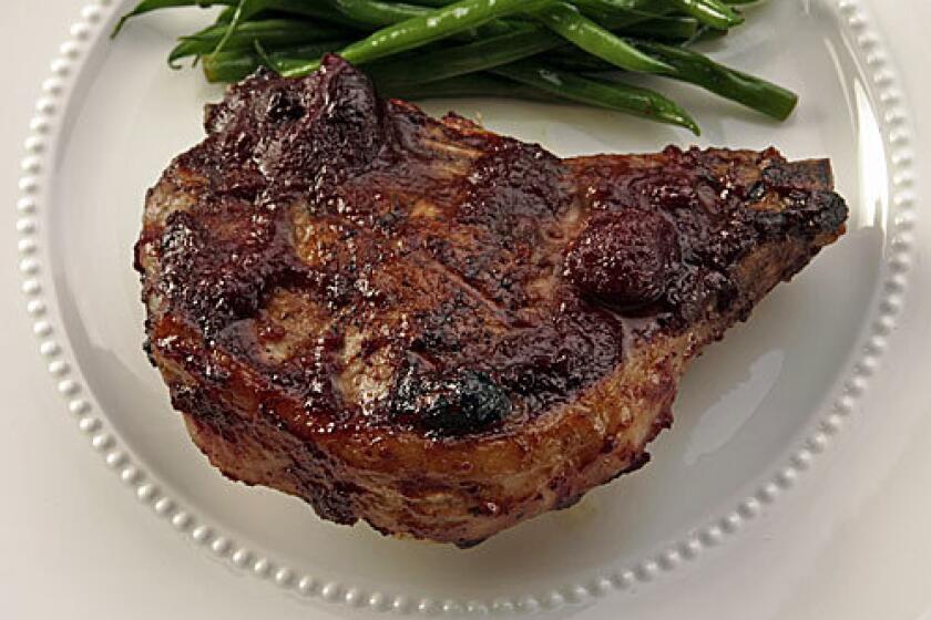 Stuffed pork chops with roasted cherry barbecue sauce.