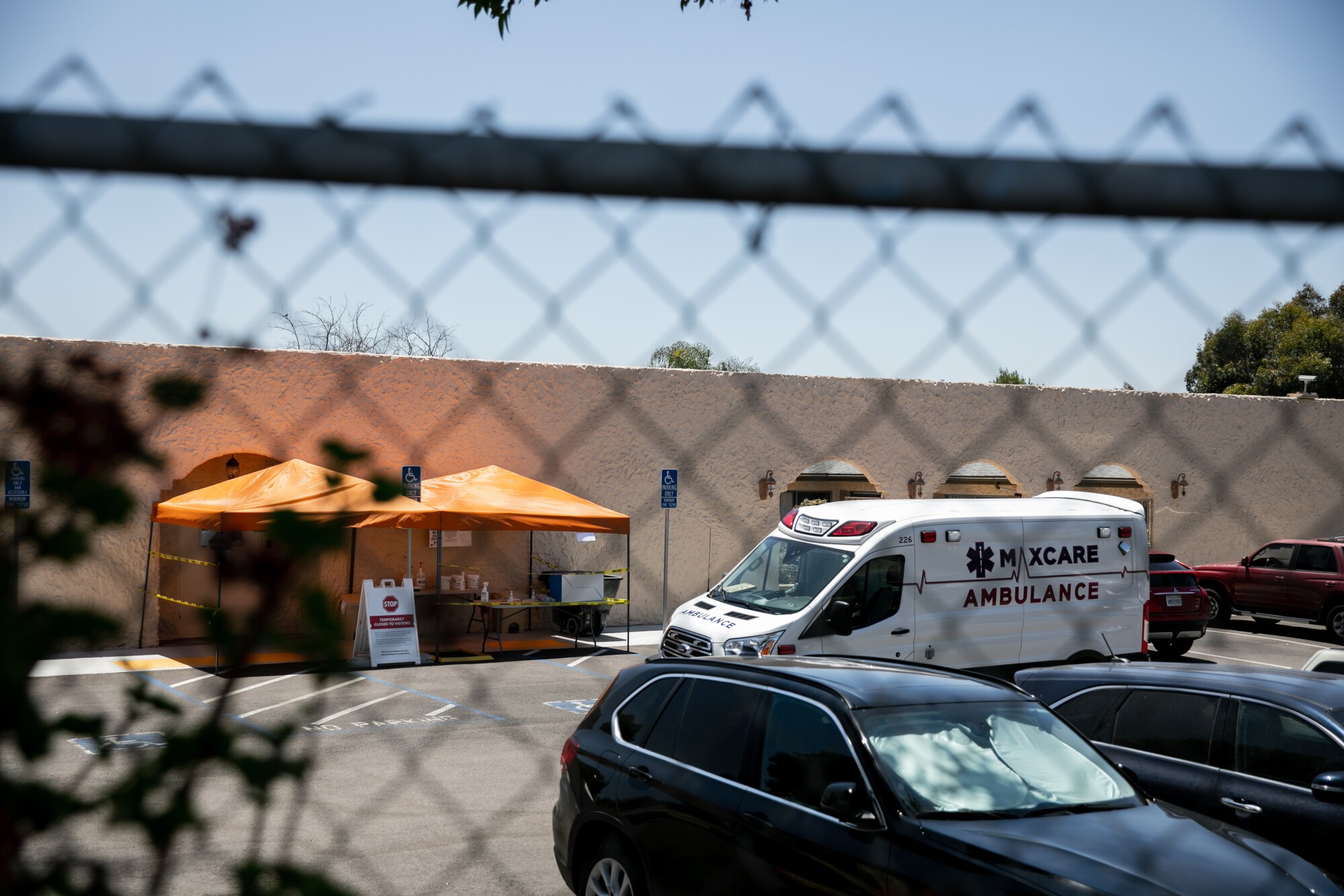 An ambulance is parked outside the Reo Vista Healthcare Center on  July 9, 2020. (Sam Hodgson / The San Diego Union-Tribune)