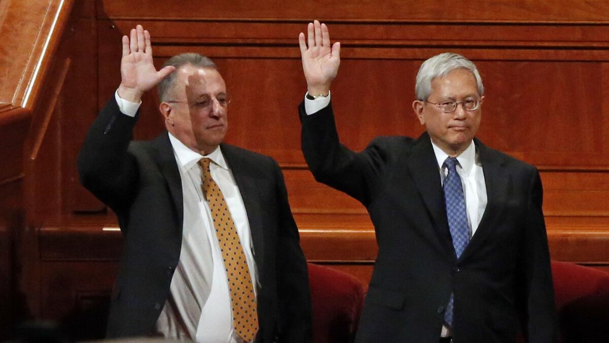 Ulisses Soares, left, of Brazil and Gerrit W. Gong, who is Chinese American, join a panel called the Quorum of the Twelve Apostles at the start of a twice-annual conference of the Church of Jesus Christ of Latter-day Saints on Saturday in Salt Lake City.