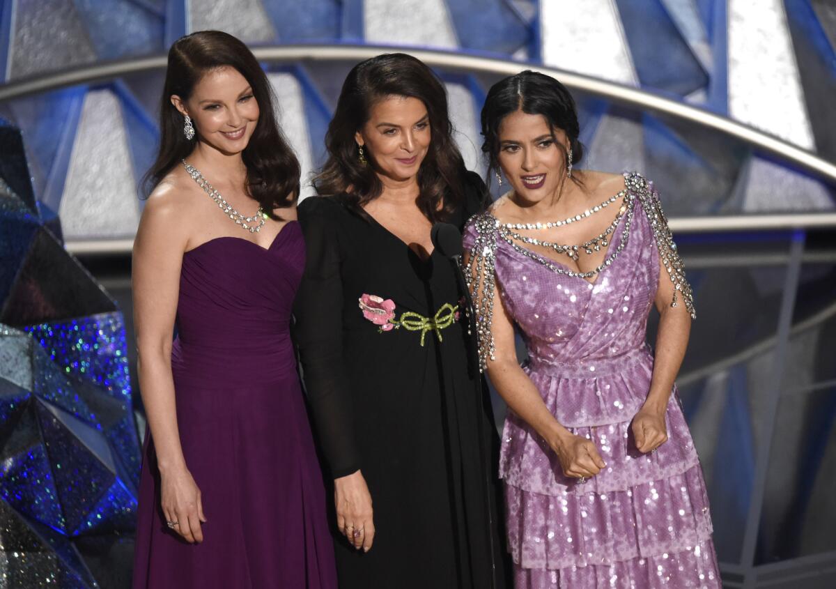 Ashley Judd, Annabella Sciorra and Salma Hayek speak at the Oscars.