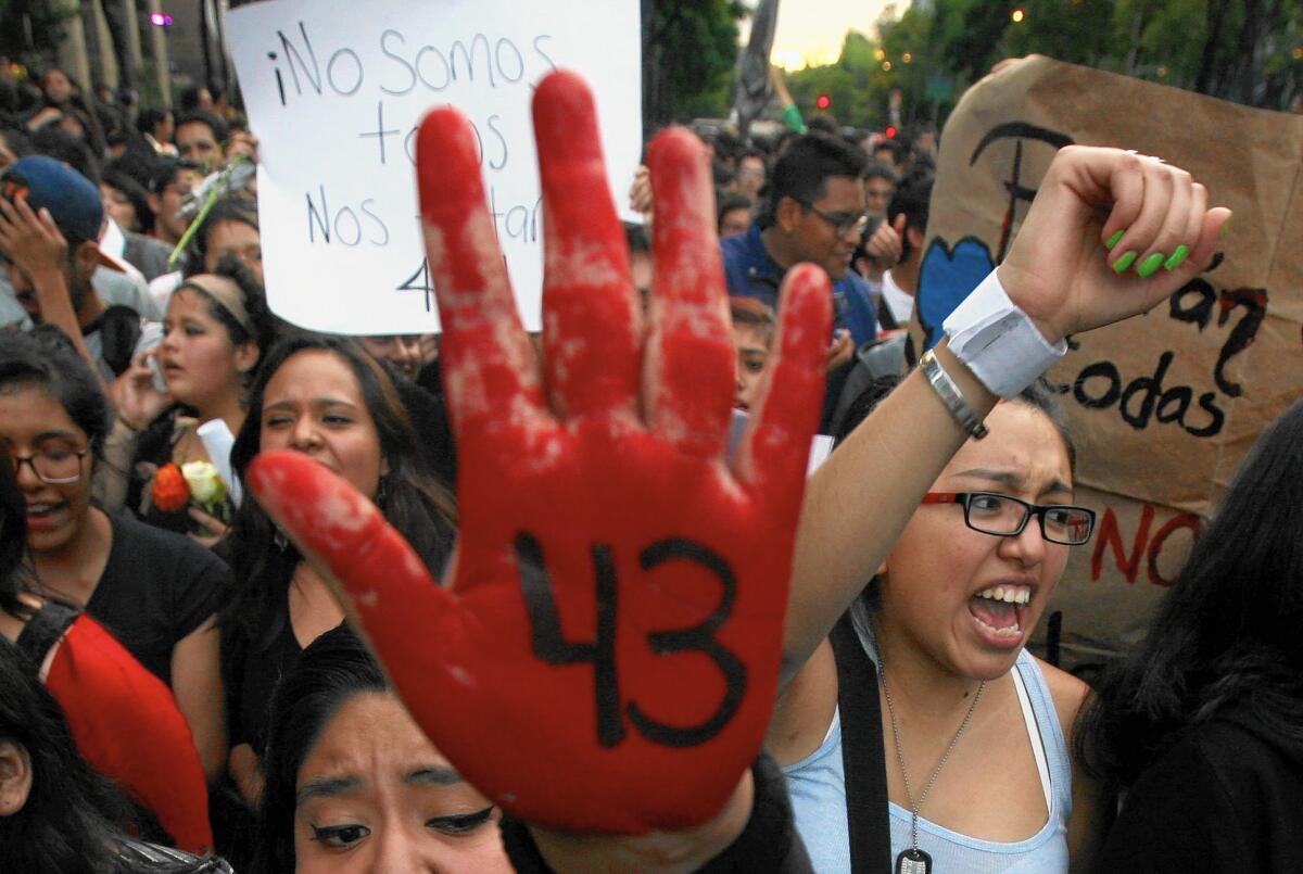 A protester's hand in Mexico City is marked with the number of missing students in Guerrero state on Oct. 22. The governor of the state was forced to resign the following day.