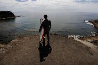 PALOS VERDES ESTATES, CA., SEPTEMBER 11, 2015: Sef Krell is a criminal defense attorney and a surfer who filed a complaint in December alleging that the Bay Boys harrassed him and destroyed his belongings at Lunada Bay in Palos Verdes Estates. He is unhappy with the police response and shows us what the bay looks like from an overlook , with the famous surf break to the right September 11, 2015 (Mark Boster/Los Angeles Times).