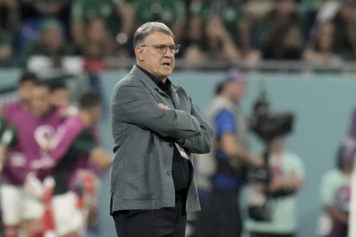 Mexico's coach Gerardo "Tata" Martino stands on the sideline during a World Cup against Poland