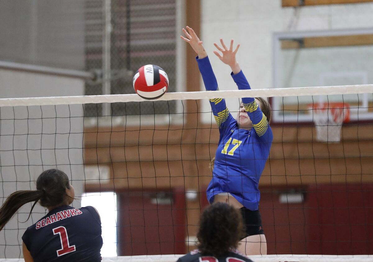 Fountain Valley's Judy Juhala (17) puts up a block during a nonleague girls' volleyball match against Ocean View on Monday.