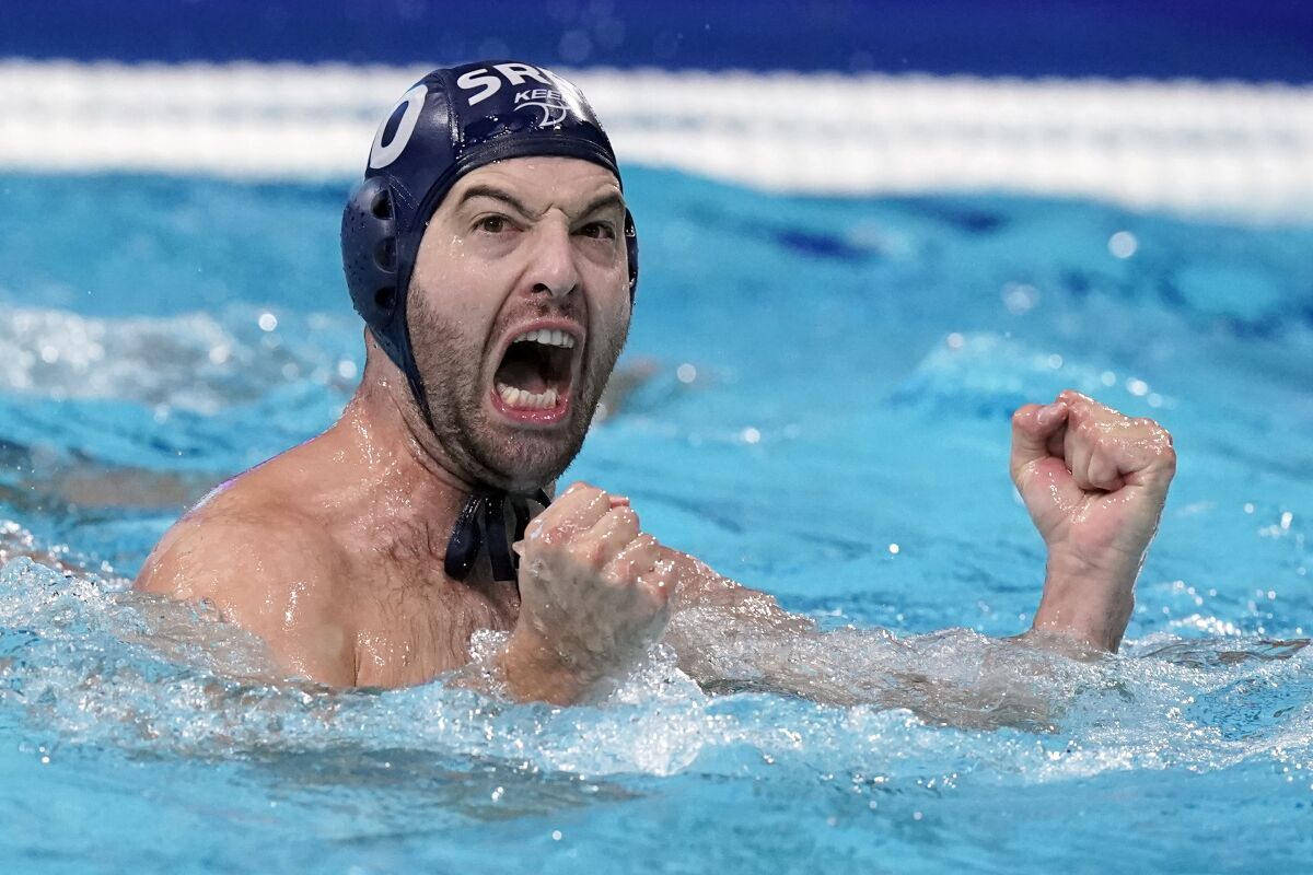 Serbia's Filip Filipovic celebrates after scoring a goal against Italy during a quarterfinal round men's water polo match at the 2020 Summer Olympics, Wednesday, Aug. 4, 2021, in Tokyo, Japan. (AP Photo/Mark Humphrey)