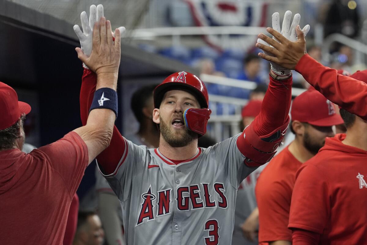 Teammates congratulate the Angels' Taylor Ward after he hit a home run in the eighth inning Wednesday.