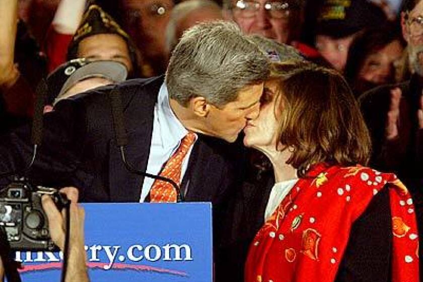 Sen. John Kerry kisses wife Teresa Heinz Kerry while celebrating his victory in the New Hampshire Primary in Manchester.