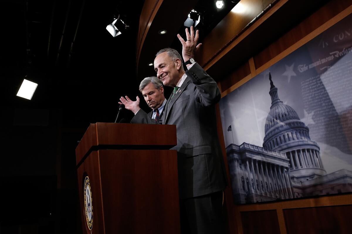 Sen. Charles Schumer (D-NY), right, and Sen. Sheldon Whitehouse (D-RI) speak about the U.S. Supreme Court decision on campaign financing decided Wednesday in McCutcheon vs. F.E.C. during a press conference at the U.S. Capitol.