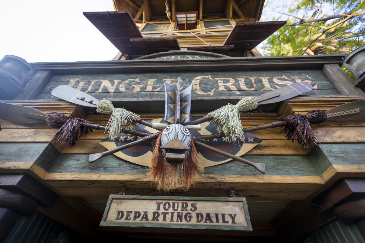 A sign reads "Jungle Cruise - Tours Departing Daily"