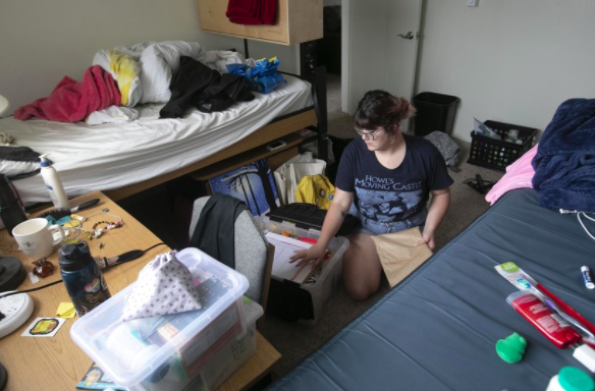 Sophomore Juniper Perkins packed her belongings as she moved out of her dormitory apartment at SDSU on Wednesday, March 18th, after the university said student residents had to be gone by the end of the day.