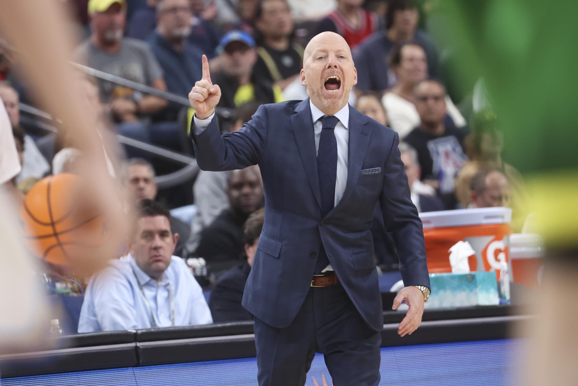 UCLA coach Mick Cronin shouts instructions to his players during a win over Oregon.