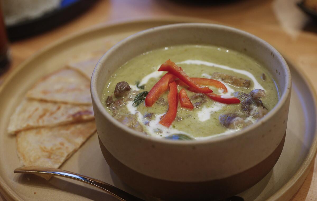 A green curry dish at restaurant Manaao in Tustin.