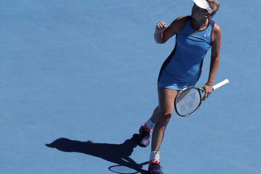 CoCo Vandeweghe celebrates after winning against Garbine Muguruza during a women's singles quarterfinal match at the Australian Open on Jan. 24.