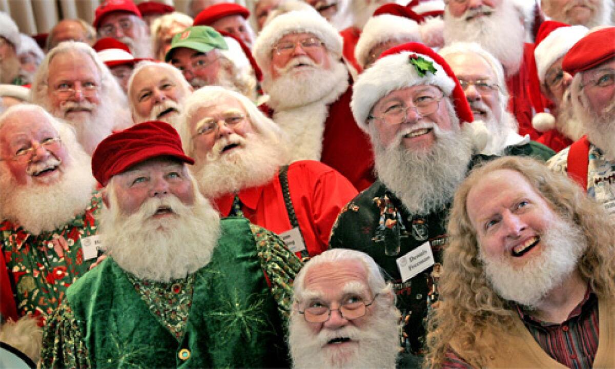 HO, HO, HO: Members of the Amalgamated Order of Real Bearded Santas pose for a group photo at their annual luncheon, held this year at Knotts Berry Farm Resort Hotel in Buena Park. They meet to promote pride and improve performance.