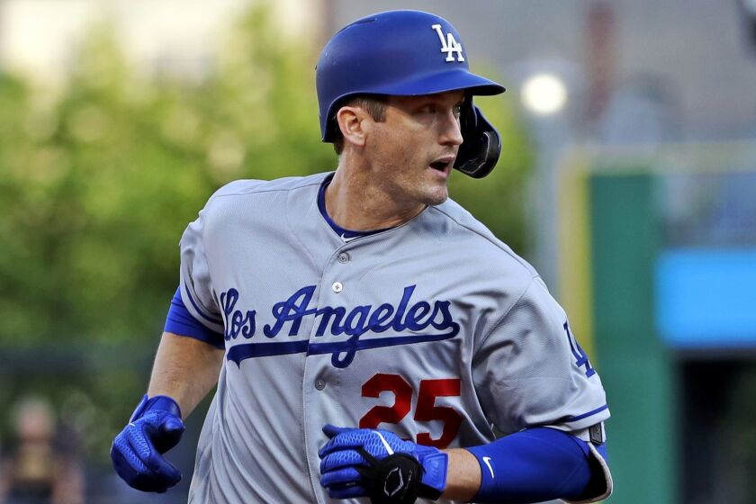 Los Angeles Dodgers' David Freese rounds third after hitting a grand slam off Pittsburgh Pirates starting pitcher Michael Feliz during the first inning of a baseball game in Pittsburgh, Friday, May 24, 2019. (AP Photo/Gene J. Puskar)