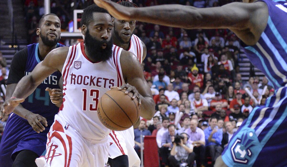 Houston Rockets guard James Harden (13) drives against the Charlotte Hornets in the second half on Tuesday.