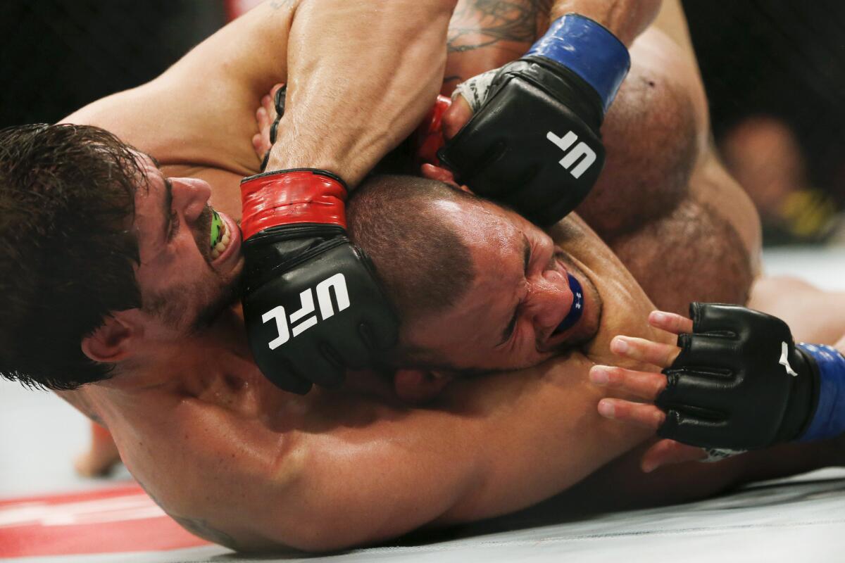 Antonio Carlos Junior chokes Eric Spicely during their middleweight fight at UFC 212.