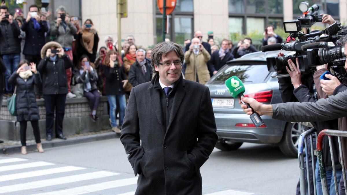 Sacked Catalan President Carles Puigdemont arrives for a news conference in Brussels on Oct. 31, 2017.