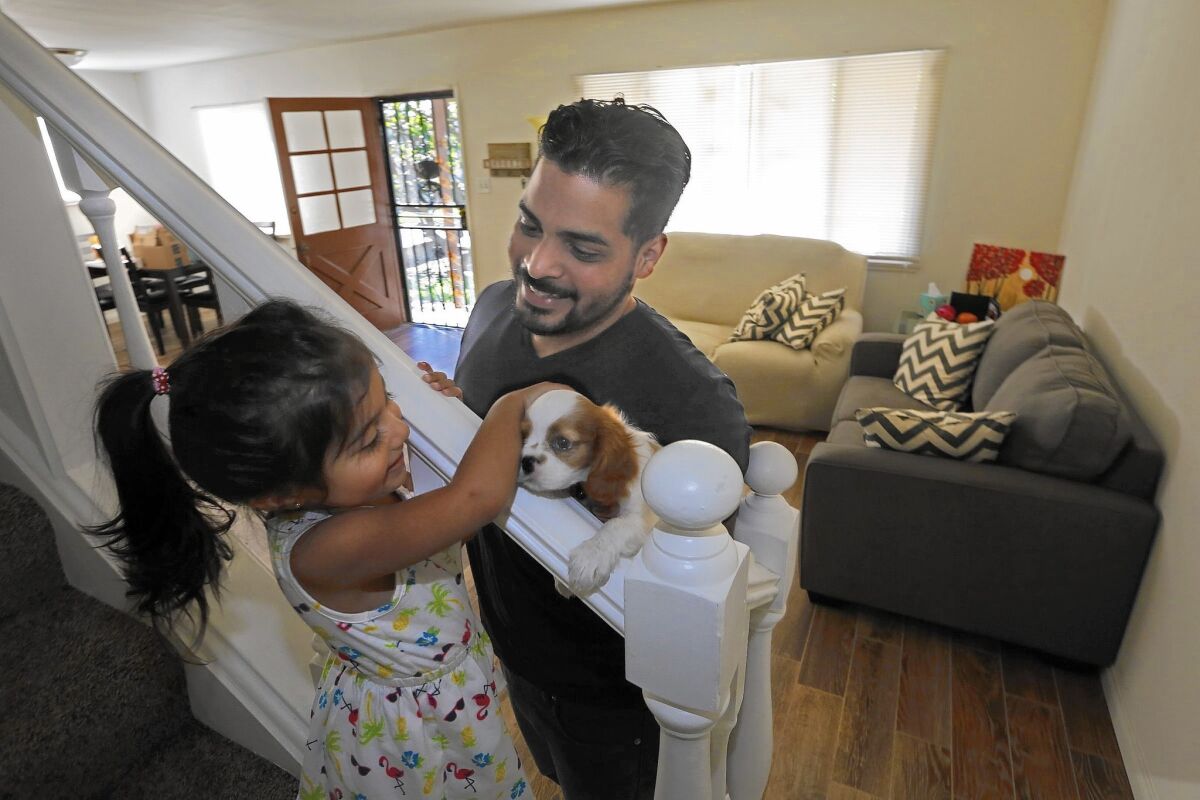 Abraham Cardona, with his daughter Dylan, chose an FHA loan from a nonbank lender when he and his wife bought a $500,000 home in La Mirada. A small down payment required by a nonbank lender was a benefit for them.