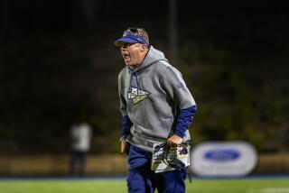 SANTA ANA, CA - APRIL 17, 2021: St John Bosco head coach Jason Negro yells at the official after his team was called for pass interference on Mater Dei in the second half at Santa Ana Stadium on April 17, 2021 in Santa Ana California.(Gina Ferazzi / Los Angeles Times)
