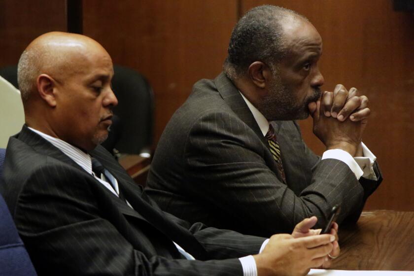 State Sen. Roderick Wright and his attorney Winston Kevin McKesson, left, listen to Los Angeles Superior Court Judge Kathleen Kennedy after jury convicted him of multiple fraud and perjury charges for living outside the district he was elected to represent.
