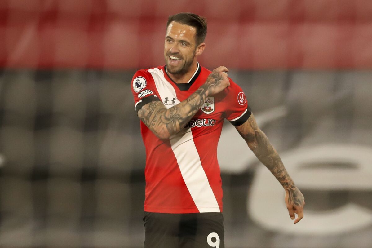 Southampton's Danny Ings celebrates after scoring his side's third goal during an English Premier League soccer match between Southampton and Crystal Palace at St Mary's Stadium in Southampton, England, Tuesday May 11, 2021. (Andrew Boyers/Pool via AP)