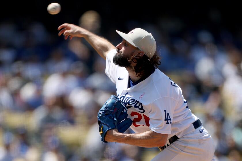 LOS ANGELES, CALIFORNIA - MAY 14: Tony Gonsolin #26 of the Los Angeles Dodgers pitches.