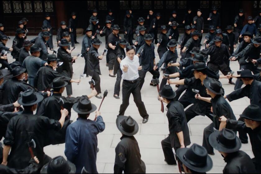 My aim is true: Ip Man (Dennis To), in his days as a Foshan policeman, takes on about 100 guys with axes. It's just another day at the office for the grandmaster in "Ip Man: Kung Fu Master."