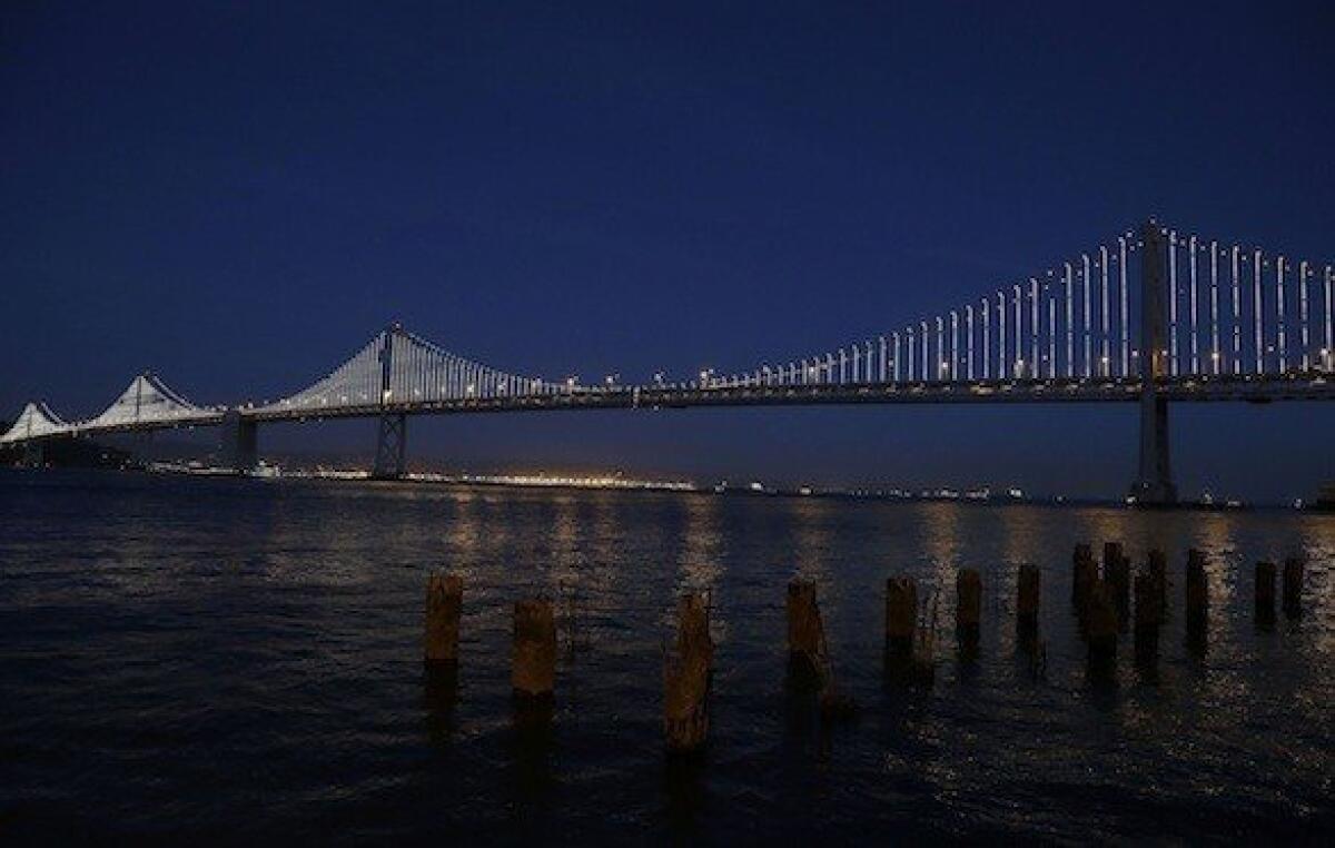 The light sculpture on the San Francisco-Oakland Bay Bridge was illuminated temporarily in February. The light sculpture will officially be lighted Tuesday night.