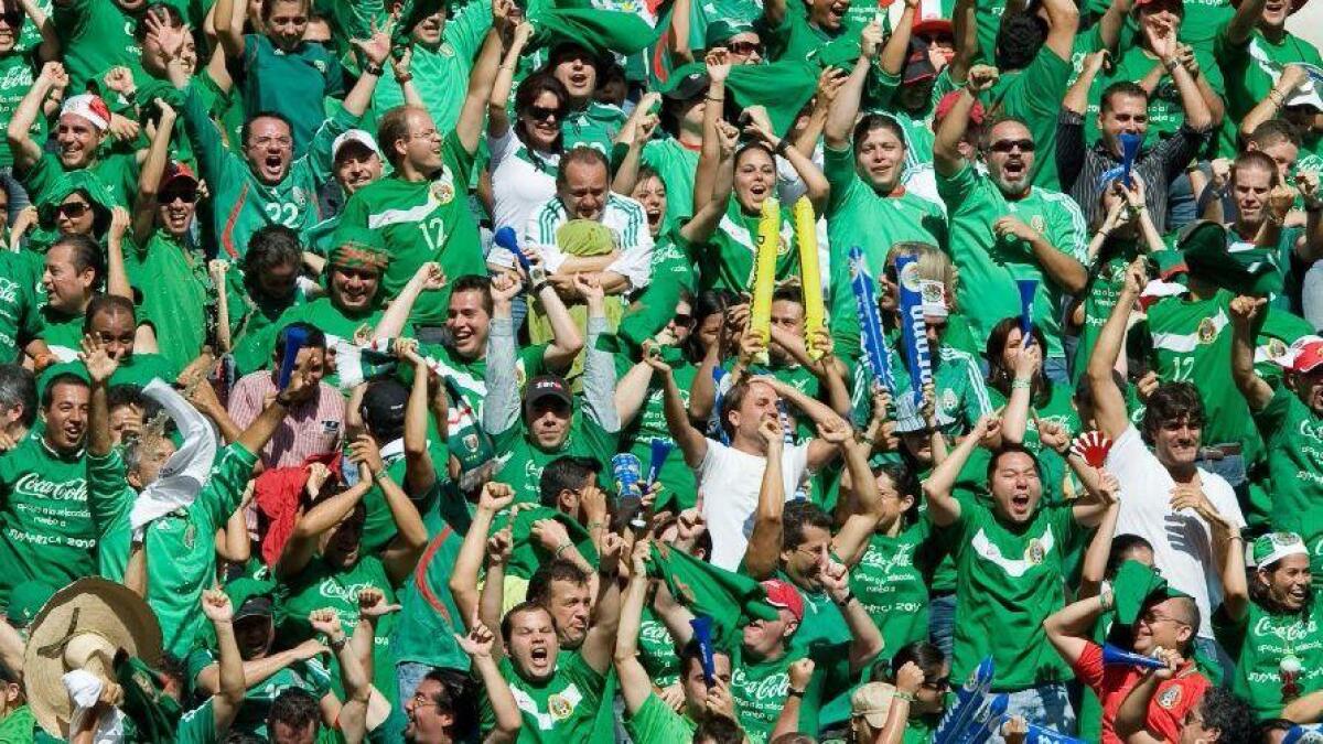 Mexico fans cheer a goal against the United States in a World Cup qualifying match at Estadio Azteca in Mexico City in 2009.