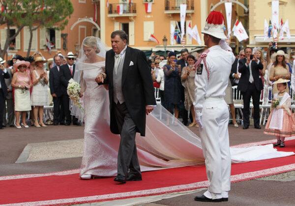 Michael Kenneth Wittstock escorts his daughter Princess Charlene to her religious wedding ceremony with Prince Albert II. The religious ceremony follows the civil ceremony held on Friday. Monaco's Albert weds Charlene in religious ceremony Monaco hosts its own royal wedding