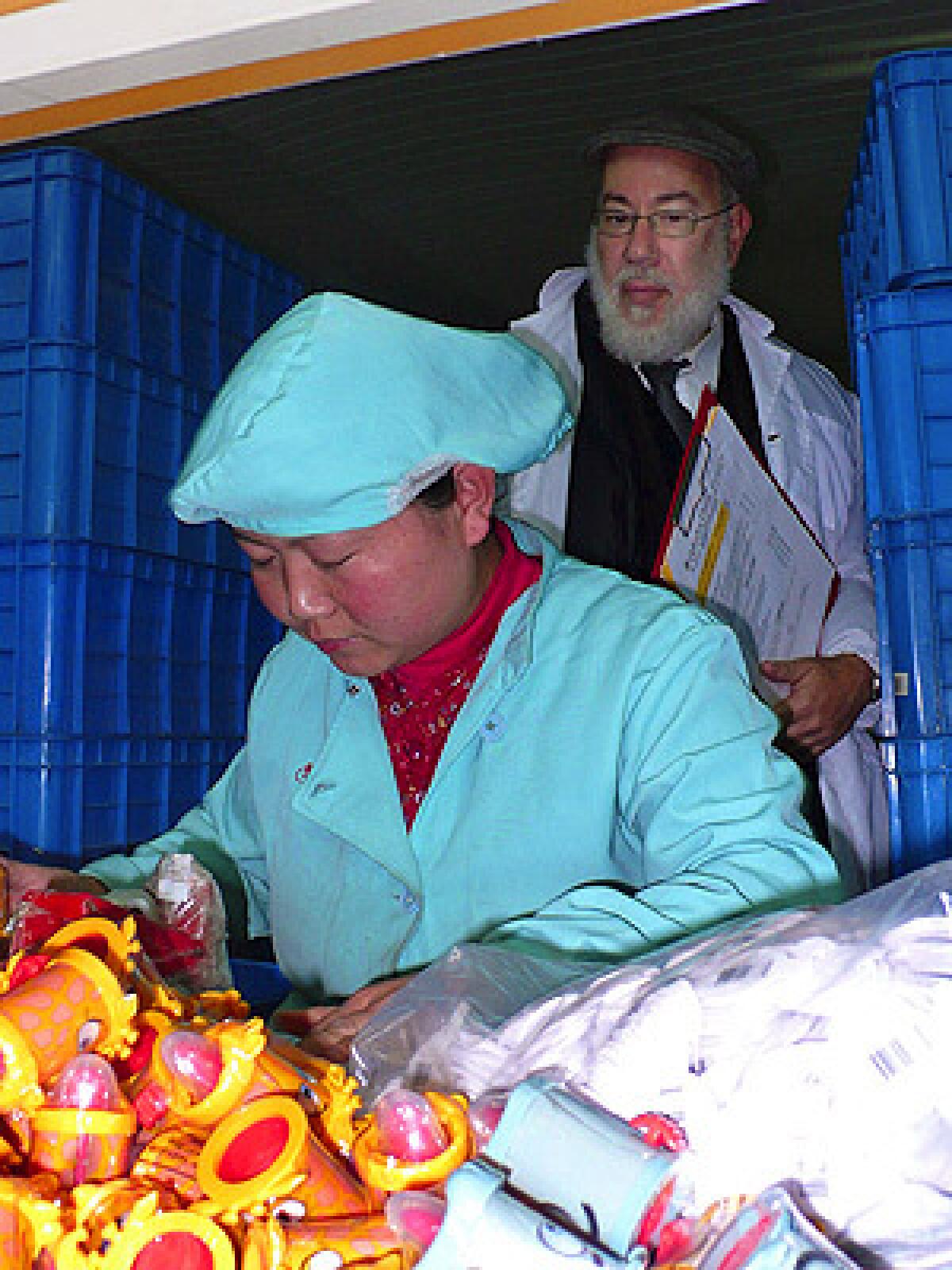 Rabbi Martin Grunberg is one of a small group of kosher food inspectors who watches over factory workers in China, the world's fastest-growing producer of kosher-certified products. Here he is on a maintenance tour of a Chinese candy factory making kosher-certified toy candies, most of it for export to the U.S. and Israel.